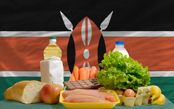Basic food groceries in front of kenya national flag