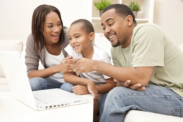 African American Family Using Laptop Computer