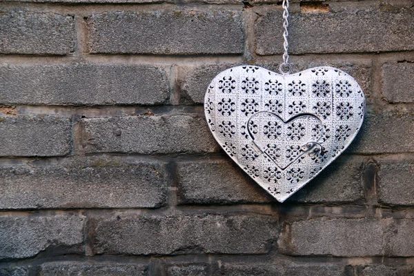 Decorative heart on the brick wall