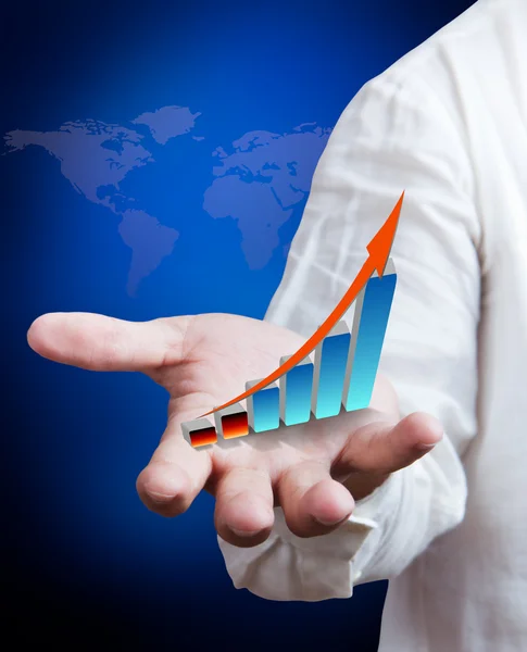 Business man holding growth graph with world map background