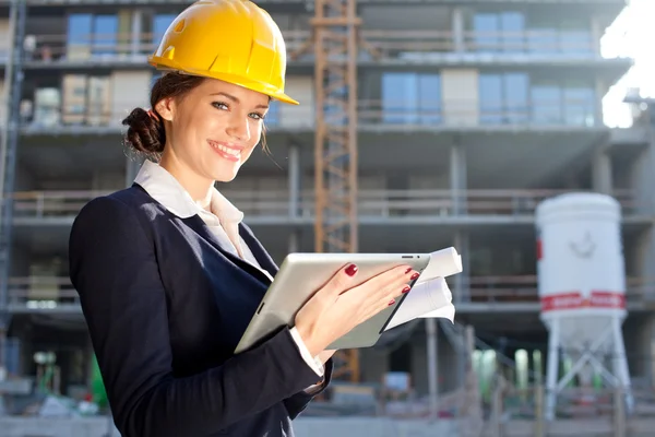 Female construction engineer / architect with a tablet computer