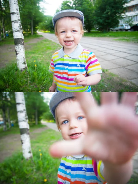 Baby boy walking in the park with funny face
