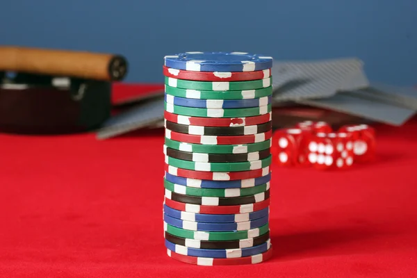 Poker chips on a red poker table close-up