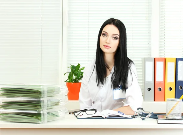 Beautiful girl doctor in the office