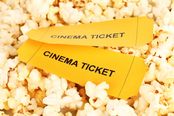 Cinema tickets on popcorn background
