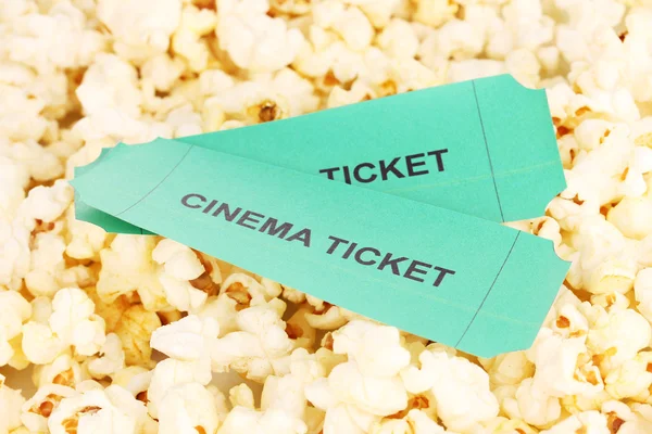 Cinema tickets on popcorn background