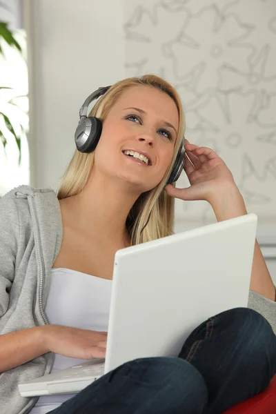 Teen with headphones and computer