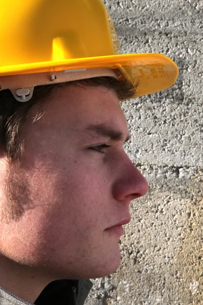 Close-up of serious looking builder