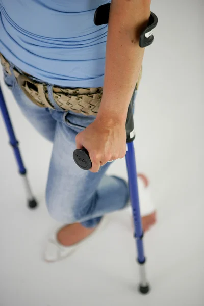 Close-up on a women on crutches