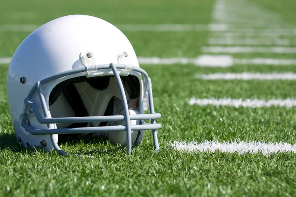 American Football Helmet on Field — Stock Photo #10779898