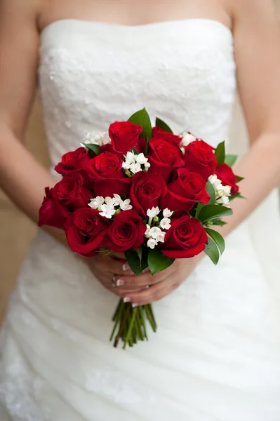 Bride showing her rose bouquet