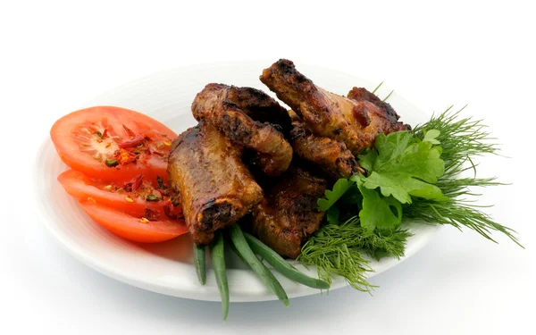 Barbecued pork ribs on white plate