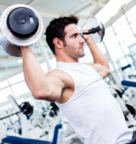 Gym man lifting weights