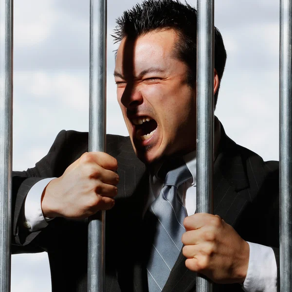 Very good looking office manager is screaming behind prison bars