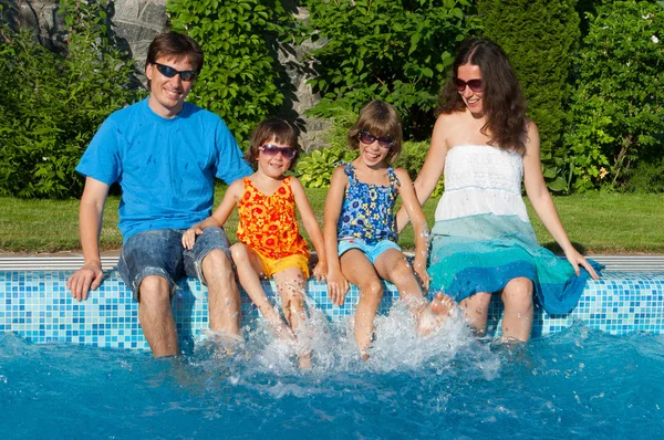 Family summer vacation, fun near swimming pool