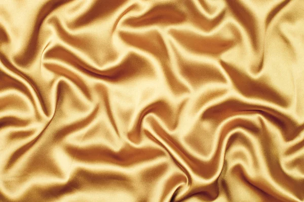 Golden satin or silk fabric as background