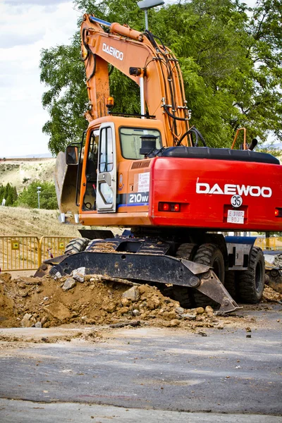 Track-type loader excavator machine doing earthmoving work at sa