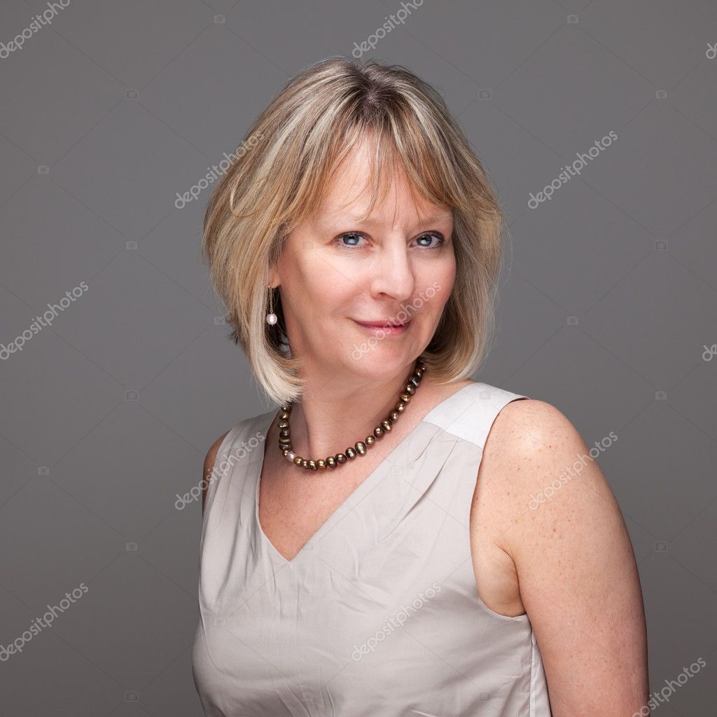 Portrait Of Attractive Smiling Mature Woman Stock Photo By Scheriton