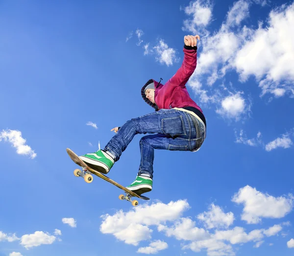 Skateboarder high in air