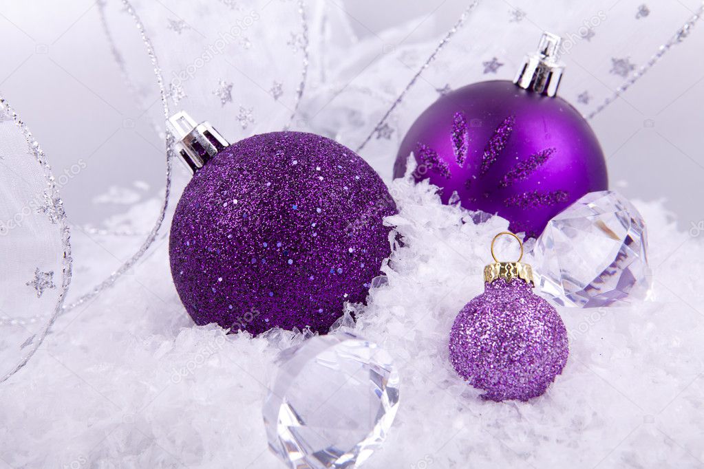 Beautiful christmas decoration in purple and silver on white snow ...