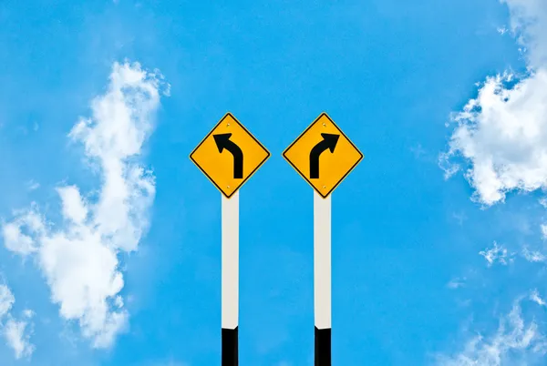 The Direction sign turn left and turn right isolated on blue ba