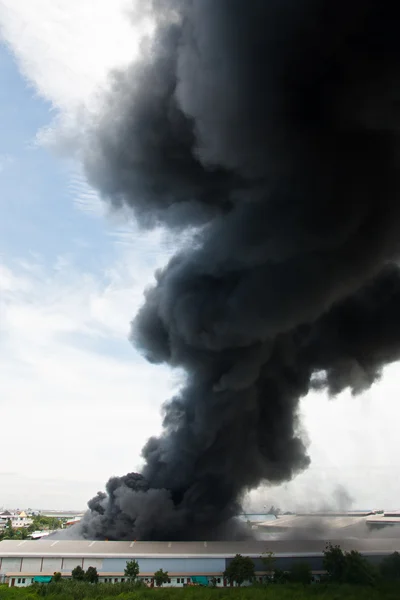 Fire burning and black smoke over cargo