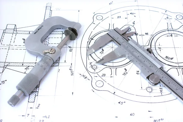 Micrometer and caliper on blueprint
