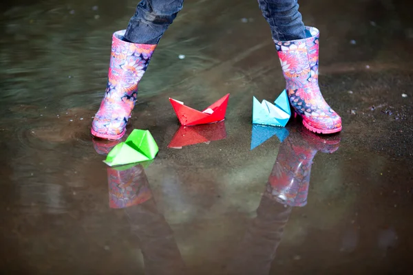 Rain boots in puddle