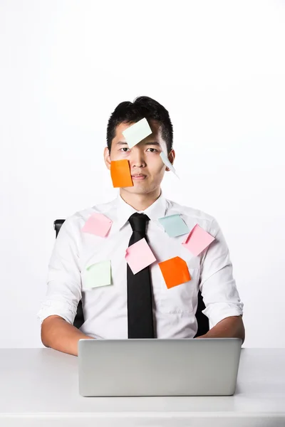 Asian Man covered in post it notes