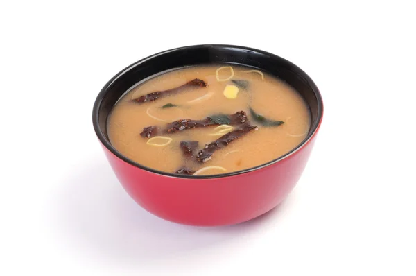 Soup. Miso soup. On a white background. Tofu, shiitake mushrooms