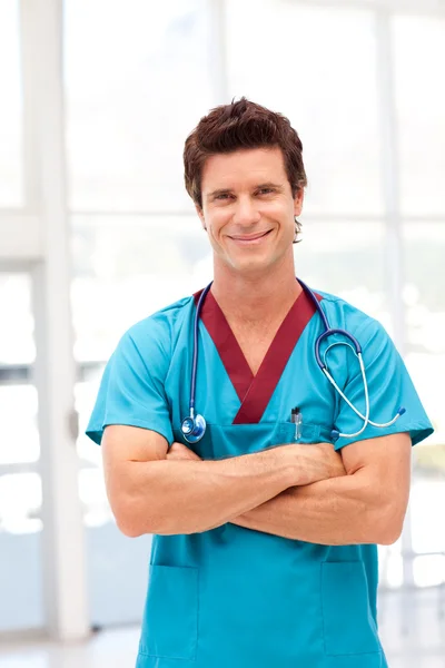 Portrait of a confident doctor in blue scrubs
