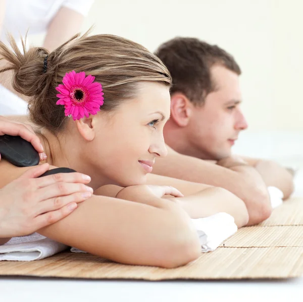 Cheerful young couple enjoying a Spa treatment