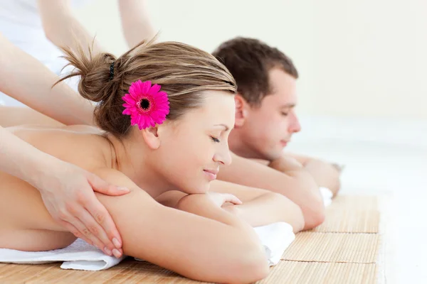 Relaxed couple having a back massage