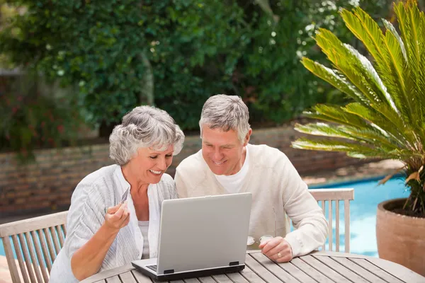 Retired couple buying something on internet