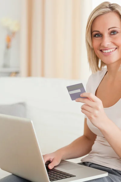 Portrait of cute woman buying online
