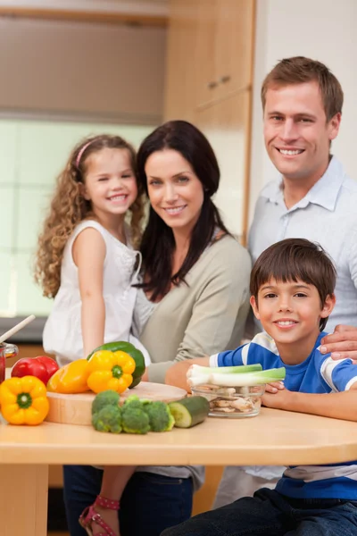 Young family standing in the kitchen
