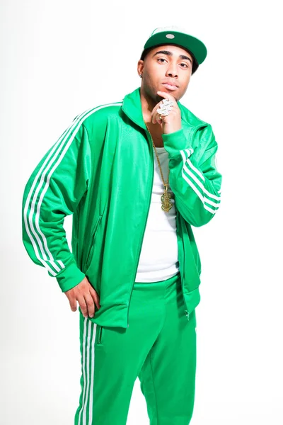 Hip hop urban black man wearing old school green suit and cap isolated on white. Looking confident. Cool guy. Studio shot.