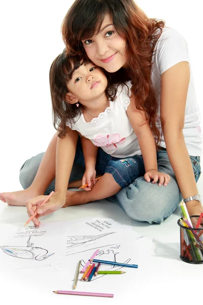 Mom and her little daughter drawing together