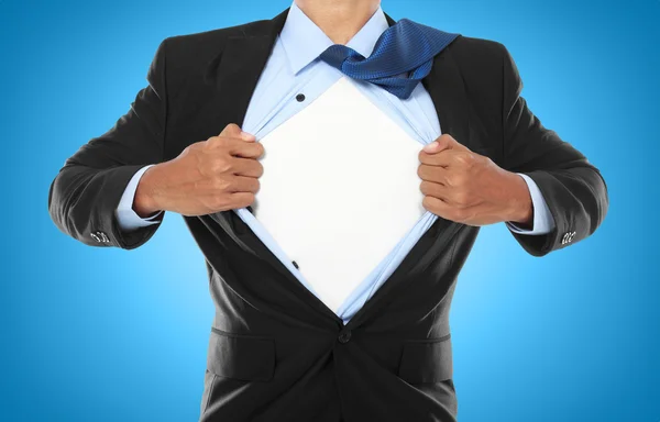 Businessman showing a superhero suit