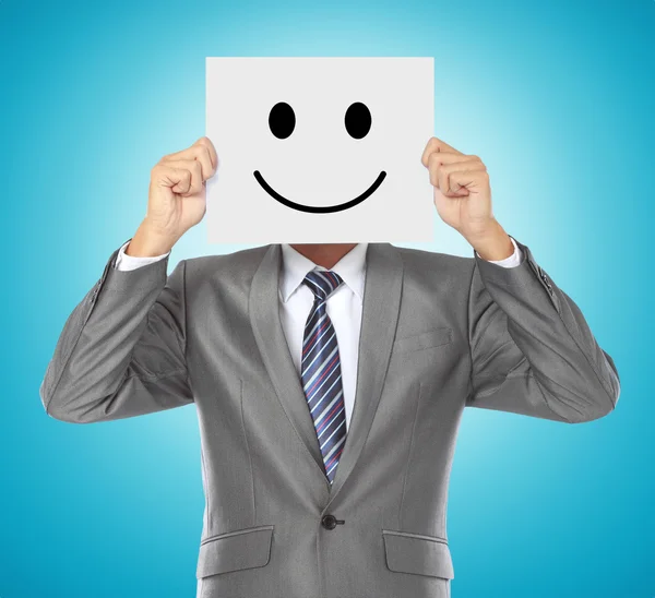Businessman with smiling mask