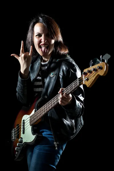 Rock Woman with Electric Bass Guitar Making the Sign of the Horns with 