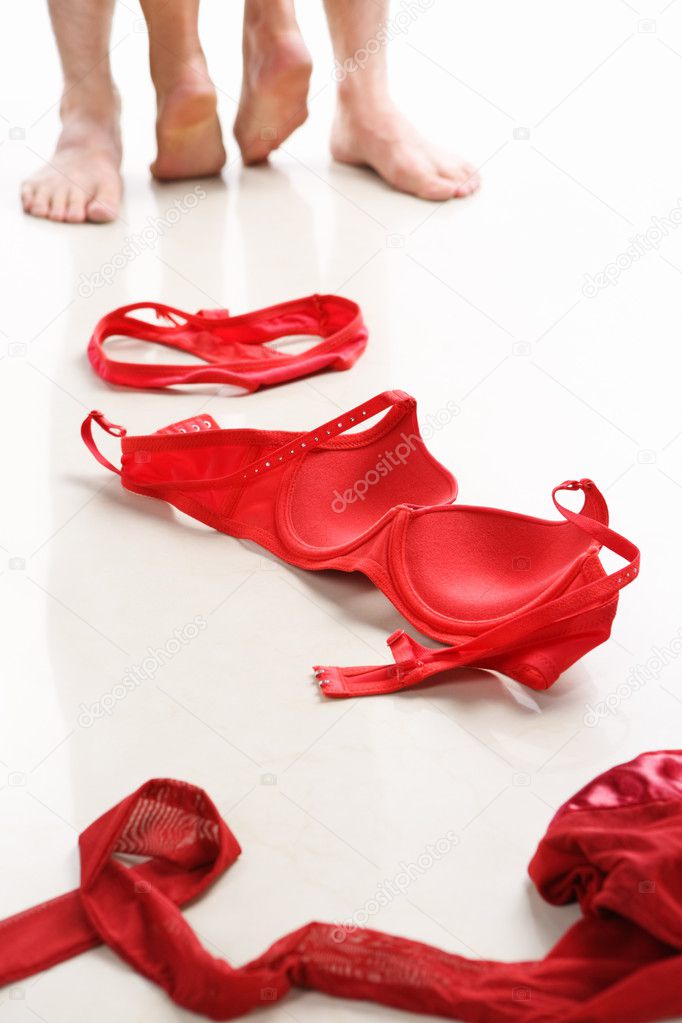 Couple Having Intercourse With Red Underwear On Floor Stock Photo