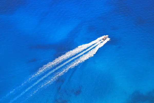 Speeds boat on the azure sea