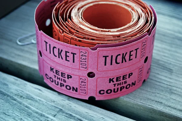 Roll of pink raffle tickets