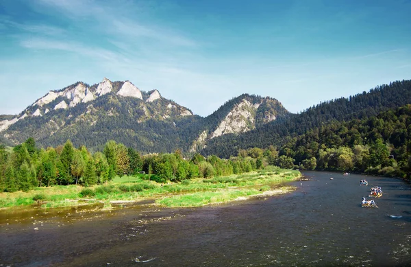 Mountains landscape with river rafting