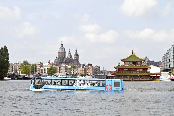 Floating bus is cruising through Amsterdam canals