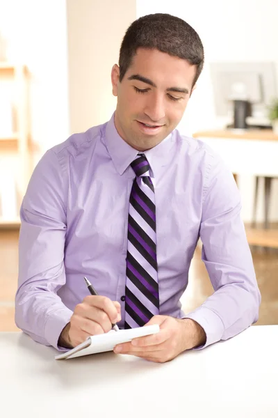 Attractive guy writing