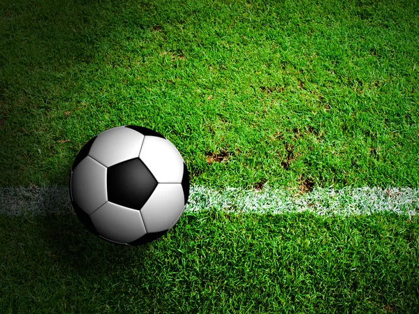 Football ( soccer ball ) in green grass field.