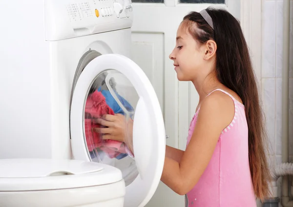 The girl is washing clothes