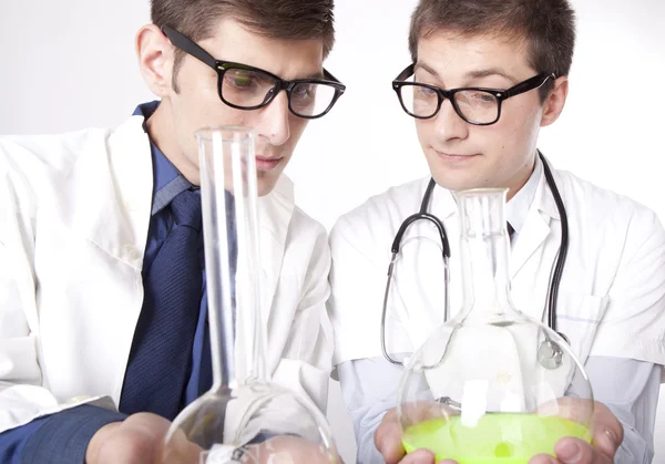Two young male laboratory technicians